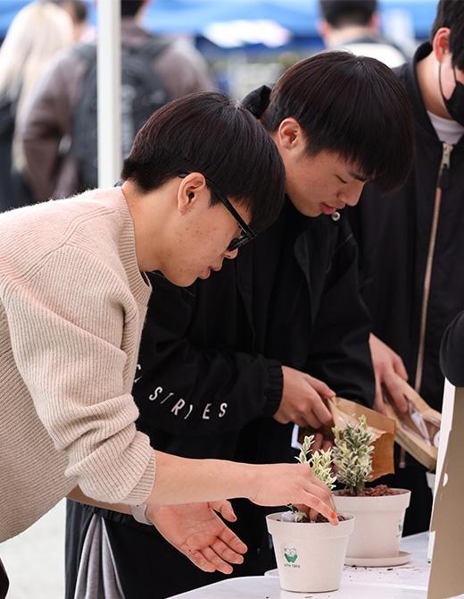 Students participating in a tree-planting experience.